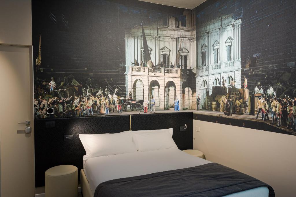 Postel nebo postele na pokoji v ubytování Italianflat - Theatrum Rooms and Suite