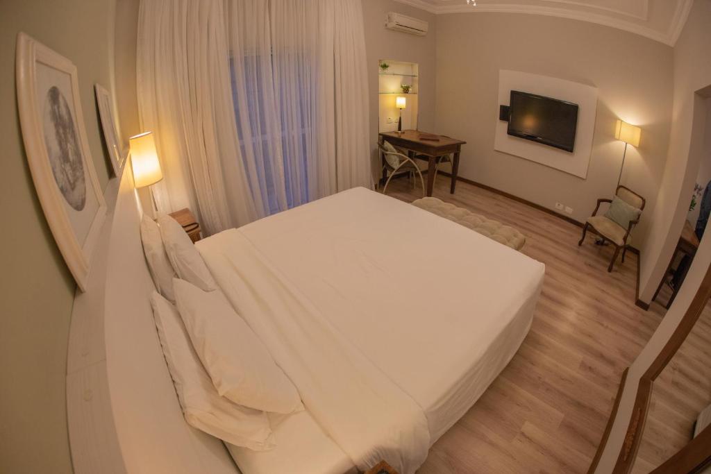 Postel nebo postele na pokoji v ubytování Planalto Select Hotel Ponta Grossa