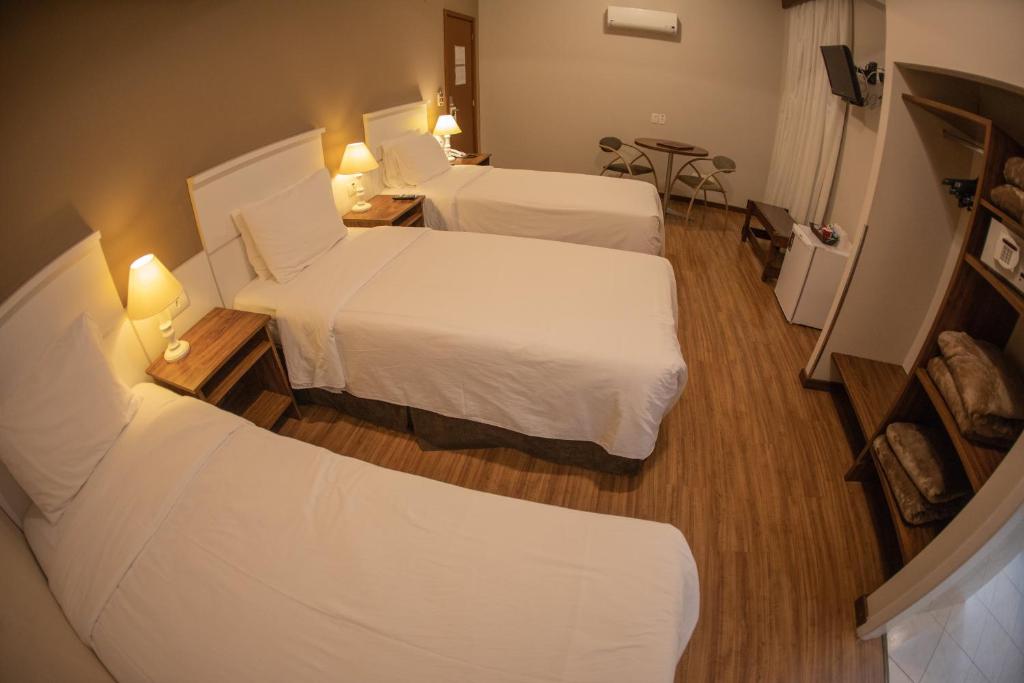 Postel nebo postele na pokoji v ubytování Planalto Select Hotel Ponta Grossa