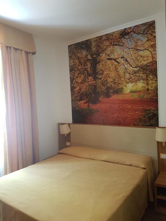 Postel nebo postele na pokoji v ubytování B&B Le Stagioni