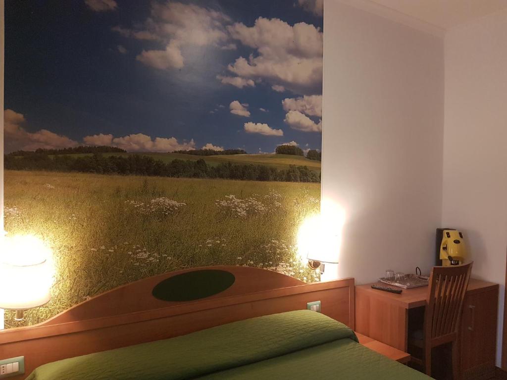 Postel nebo postele na pokoji v ubytování B&B Le Stagioni