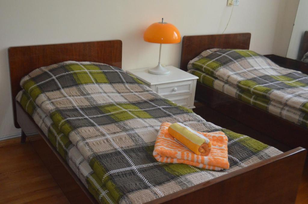 Postel nebo postele na pokoji v ubytování Alex's Cosy Guesthouse