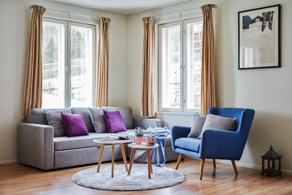 a living room with a couch and two chairs at Apartments in Porvoo in Porvoo