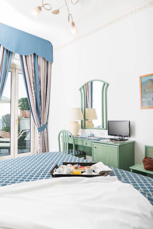 Postel nebo postele na pokoji v ubytování Hotel Il Nido