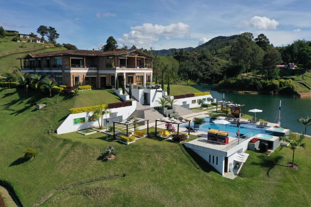 an aerial view of a house with a swimming pool at Hotel La Magdalena Adult Only in Guatapé