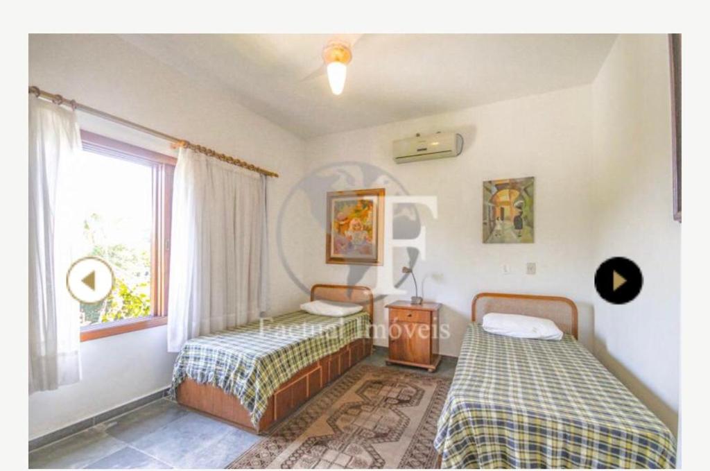  Deslumbrante casa condomínio fechado praia de Pernambuco - Guarujá