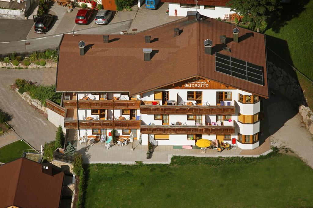 an overhead view of a house with a roof at Apartments Sunseit'n in Sesto