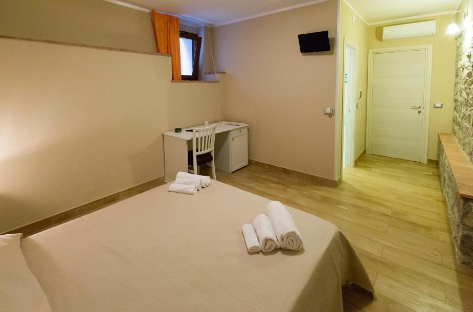Postel nebo postele na pokoji v ubytování B&B Incanto del Mare