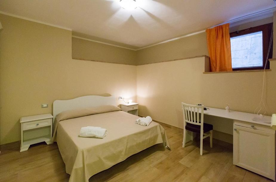 Postel nebo postele na pokoji v ubytování B&B Incanto del Mare