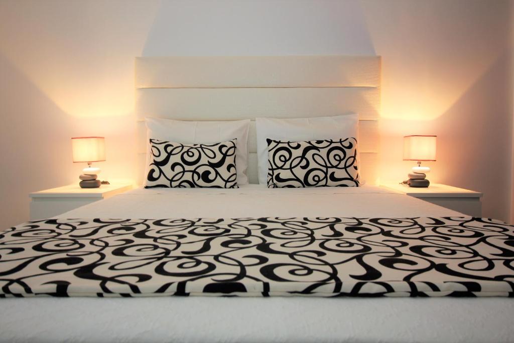 Giường trong phòng chung tại Apartamentos Gaivota Holidays