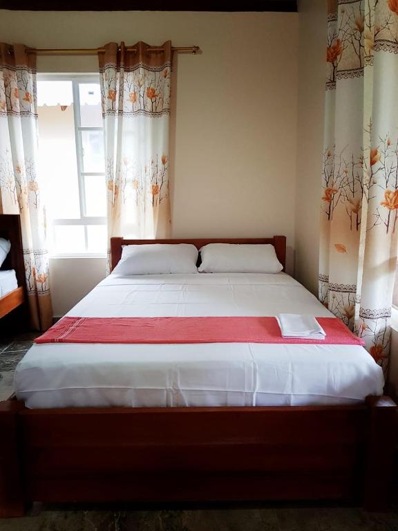 Postel nebo postele na pokoji v ubytování Coco Loco Lodge