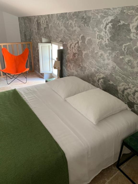 Un pat sau paturi într-o cameră la 7 Hotel Particulier