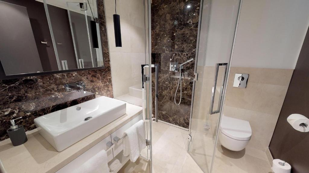 Koupelna v ubytování White Pearl Apartment 0.02