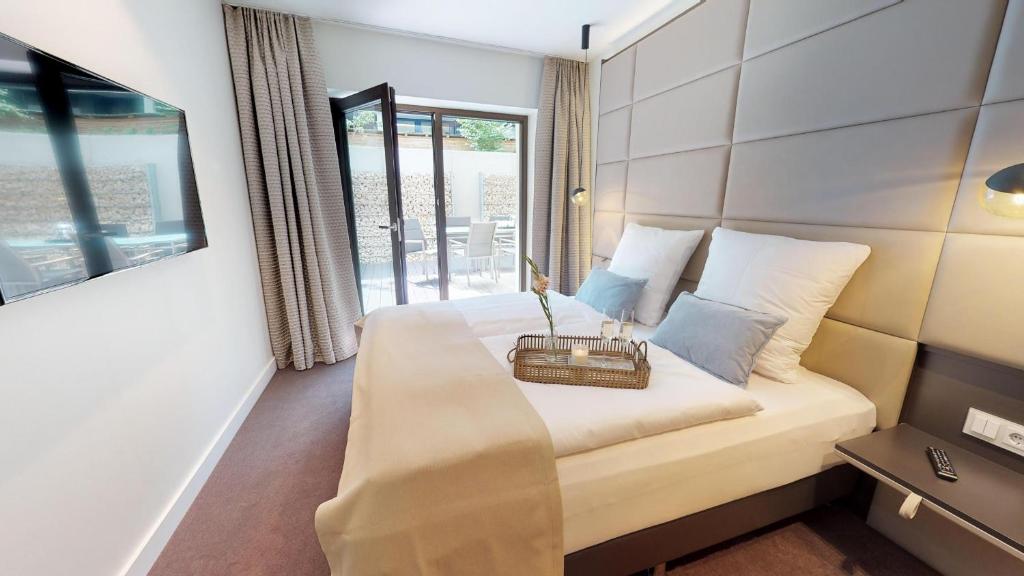 Postel nebo postele na pokoji v ubytování White Pearl Apartment 0.02