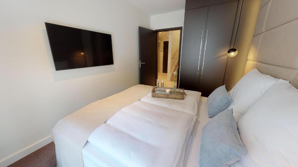 Postel nebo postele na pokoji v ubytování White Pearl Apartment 0.02