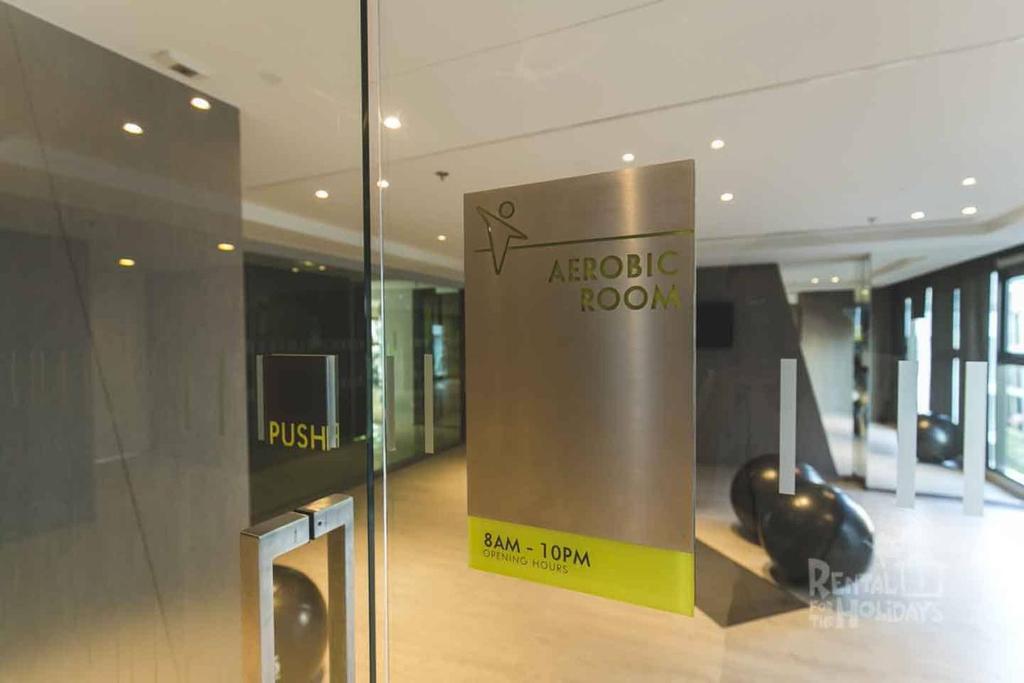 a lobby of a building with a sign on a glass wall at the base condo 88/96 in Pattaya Central