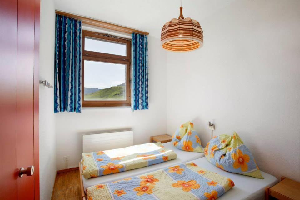 Postel nebo postele na pokoji v ubytování Berggasthaus Tannalp