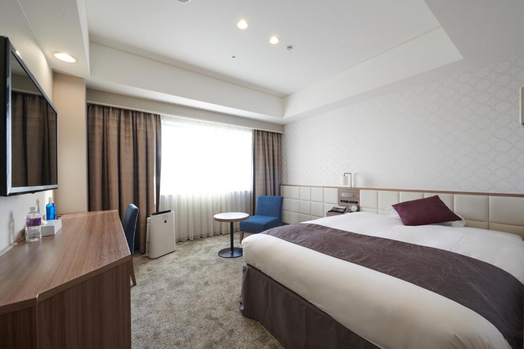 Postel nebo postele na pokoji v ubytování HOTEL VISCHIO AMAGASAKI by GRANVIA