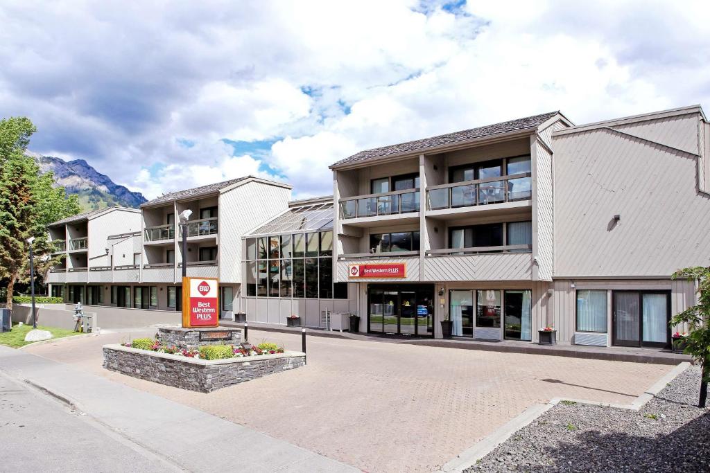 a large building with a sign on the side of it at Best Western Plus Siding 29 Lodge in Banff