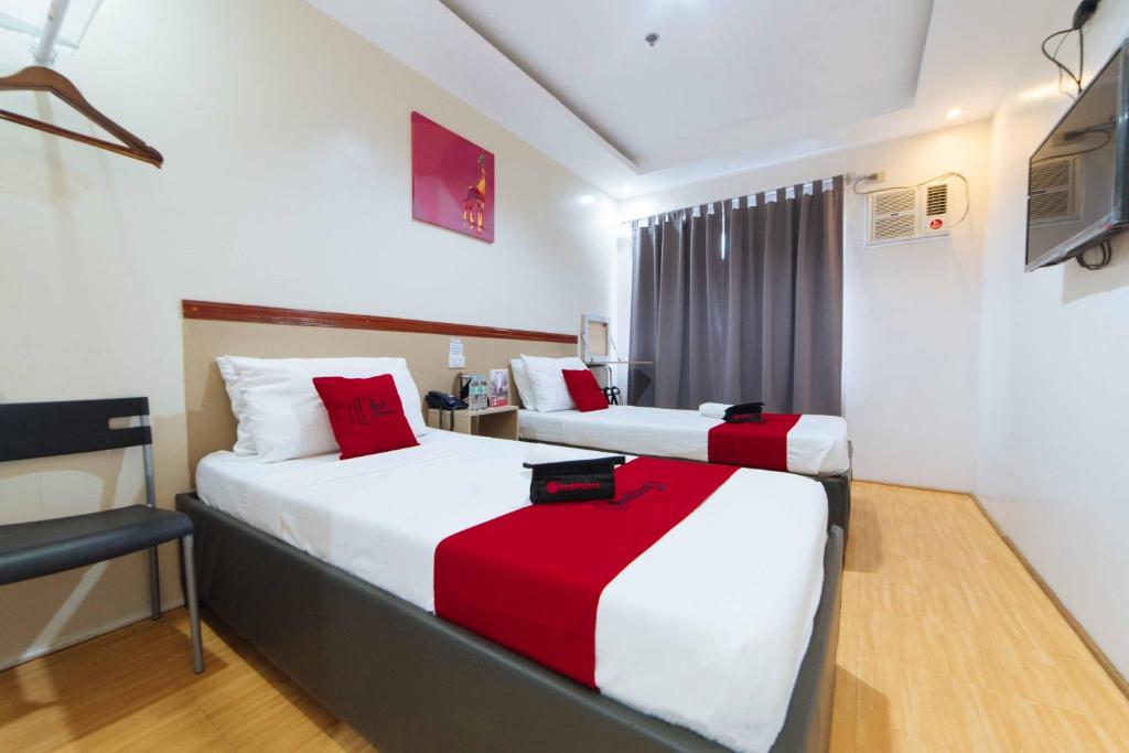Postel nebo postele na pokoji v ubytování RedDoorz Plus near SM Lanang Davao