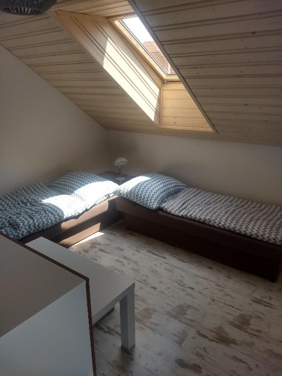 A bed or beds in a room at Chalupa Máša