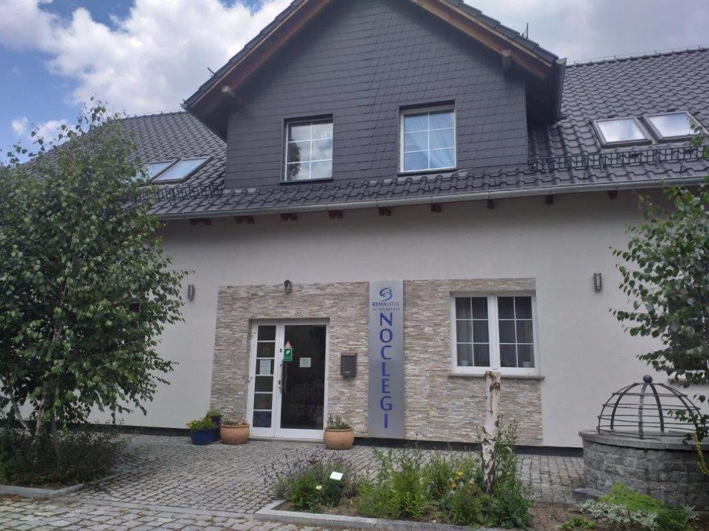a house with a sign on the front of it at Reha Vital in Stare Siołkowice