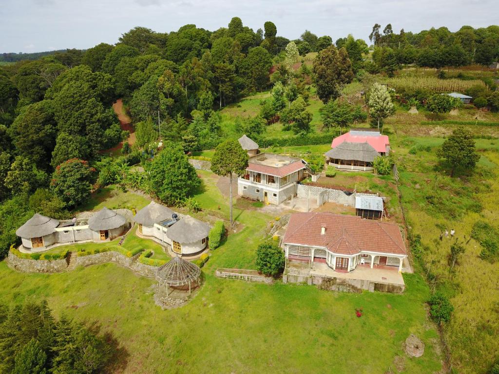 an aerial view of a large house on a hill at Kilima Resort in Iten