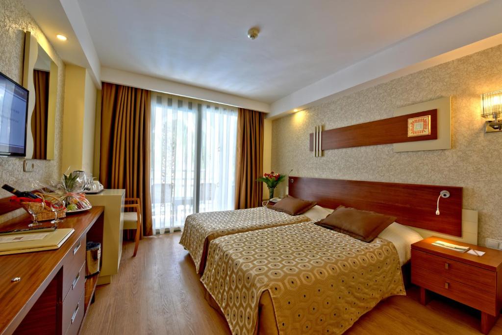 Postel nebo postele na pokoji v ubytování Side Star Beach Hotel - Ultra All Inclusive