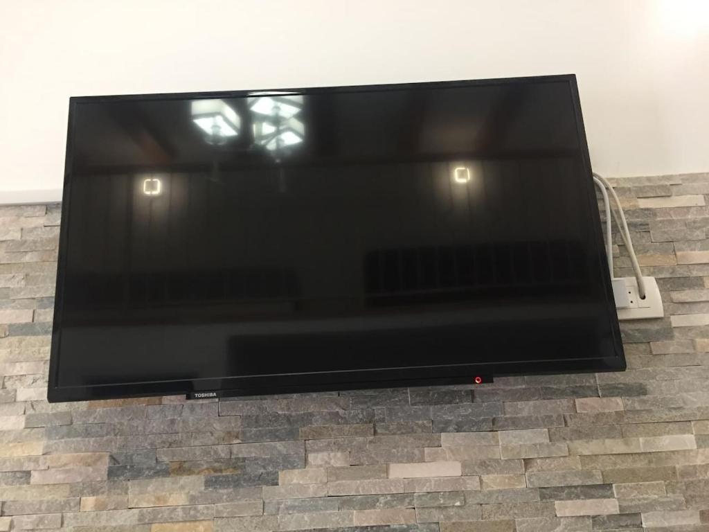 Televízia a/alebo spoločenská miestnosť v ubytovaní ST-Gallery Apartment