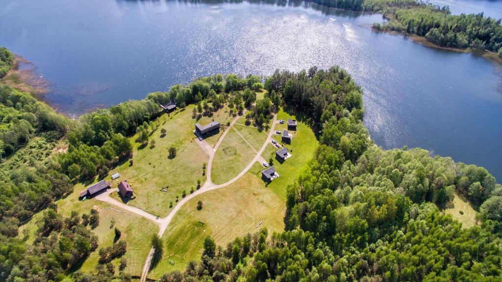 an aerial view of an island in the middle of a lake at Ramybes Uostas in Švedriškė