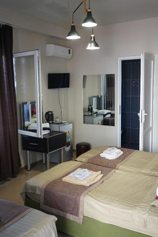 Postel nebo postele na pokoji v ubytování Ponto Hotel