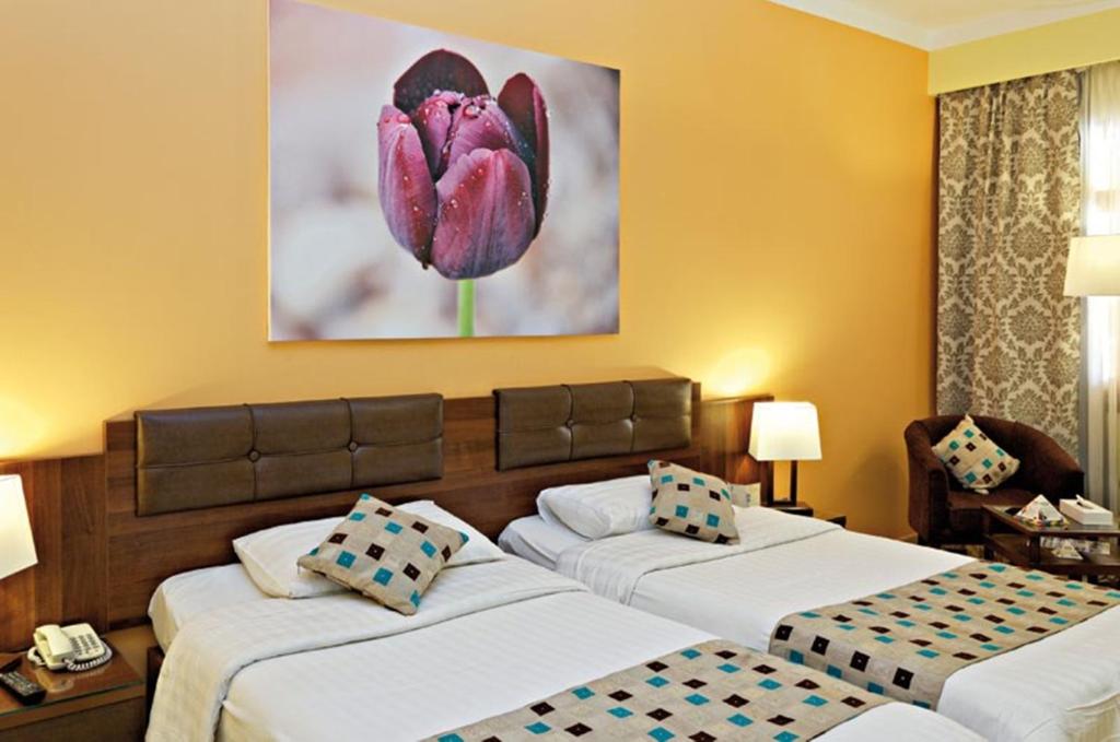 Postel nebo postele na pokoji v ubytování Three Corners Rihana Resort El Gouna