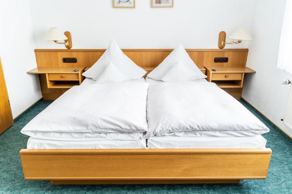 Postel nebo postele na pokoji v ubytování Hotel Rieder