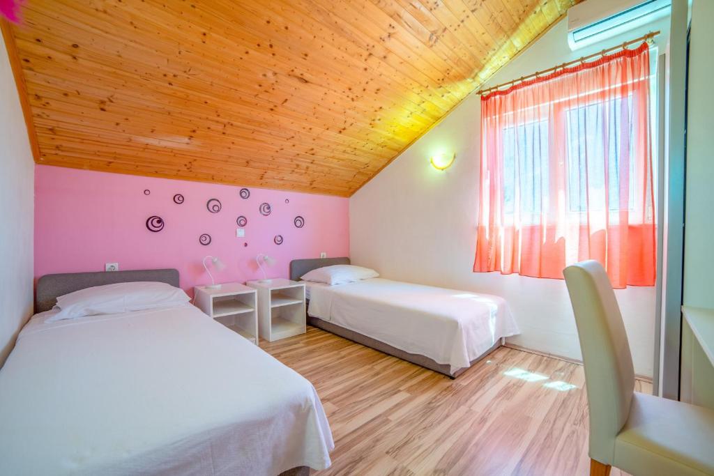 Postel nebo postele na pokoji v ubytování Holiday Home Tina