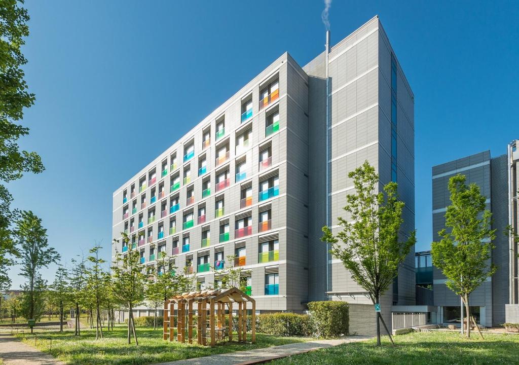 an office building with colorful windows at Camplus Guest Bononia Casa per Ferie in Bologna