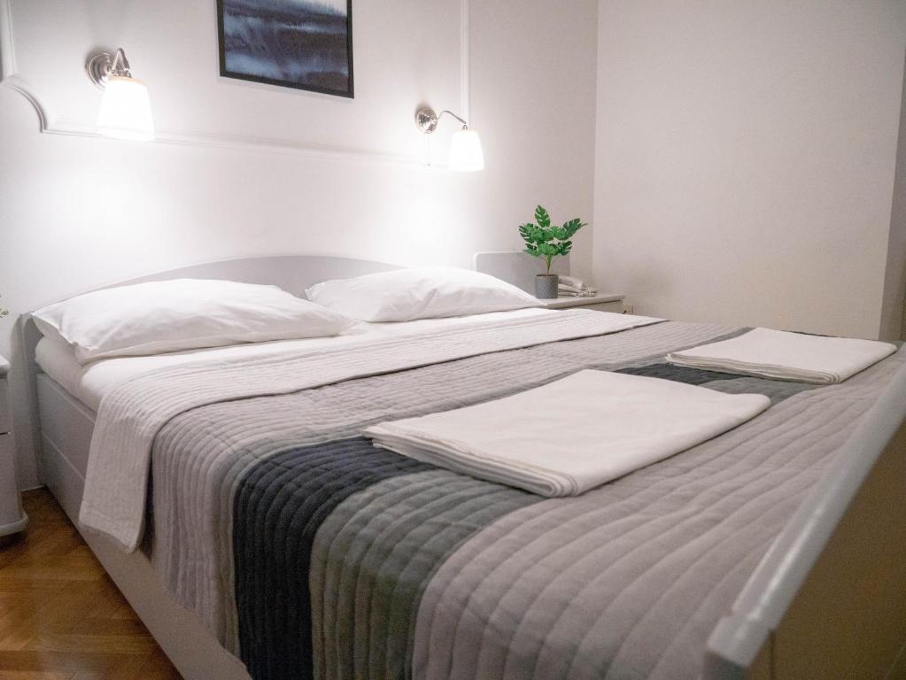 Posteľ alebo postele v izbe v ubytovaní Hotel Vienna