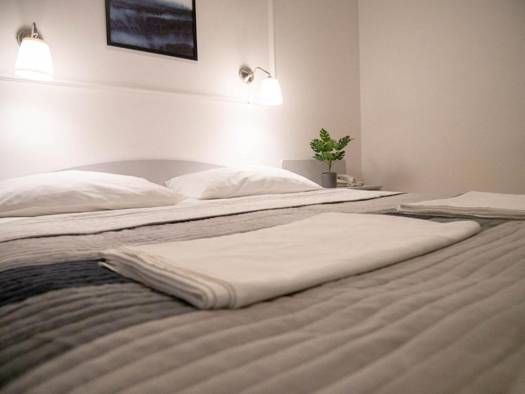 Posteľ alebo postele v izbe v ubytovaní Hotel Vienna