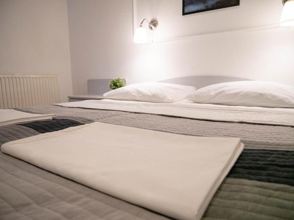 Posteľ alebo postele v izbe v ubytovaní Hotel Vienna
