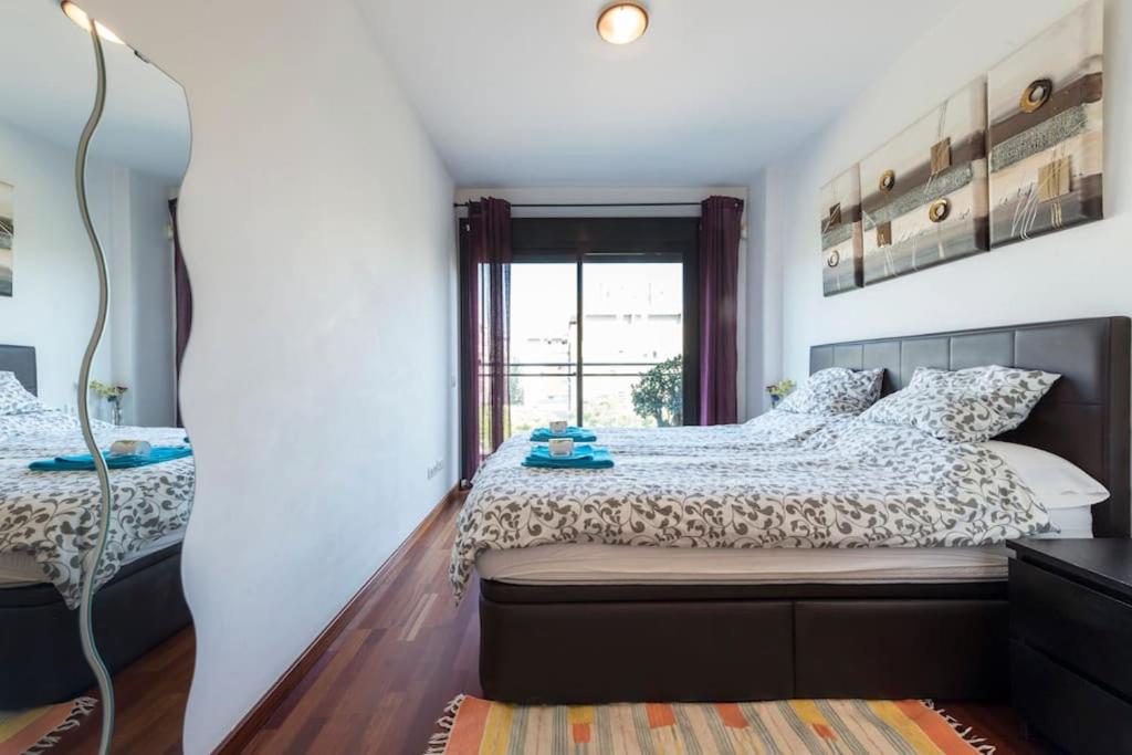 Posteľ alebo postele v izbe v ubytovaní Jie Apartment