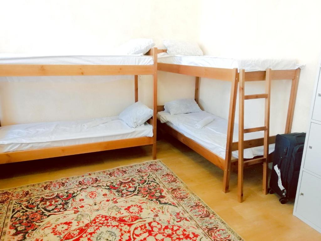 Postel nebo postele na pokoji v ubytování ВВ-ХОСТЕЛ