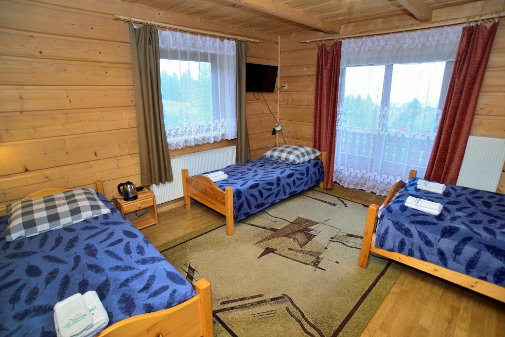 Postel nebo postele na pokoji v ubytování Pod Gorcami