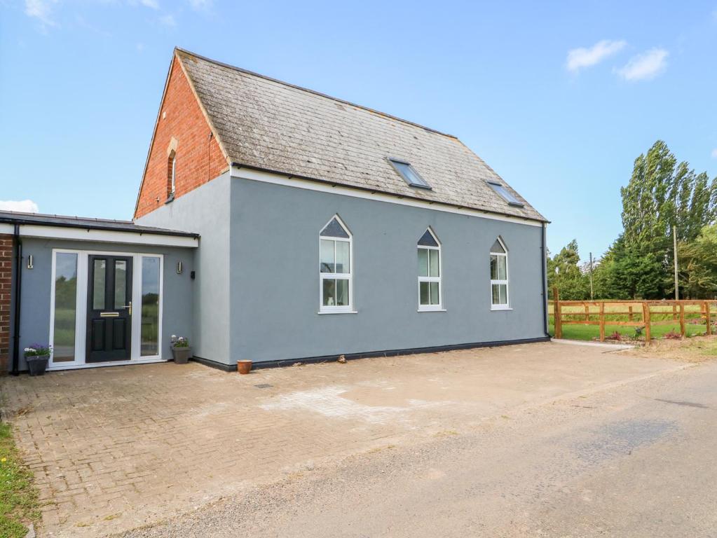 an image of a detached house with a driveway at The Olde Chapel in Boston