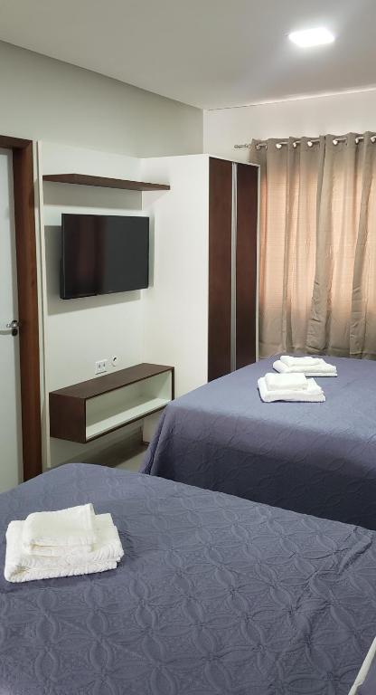 Postel nebo postele na pokoji v ubytování Flats Grangeiro