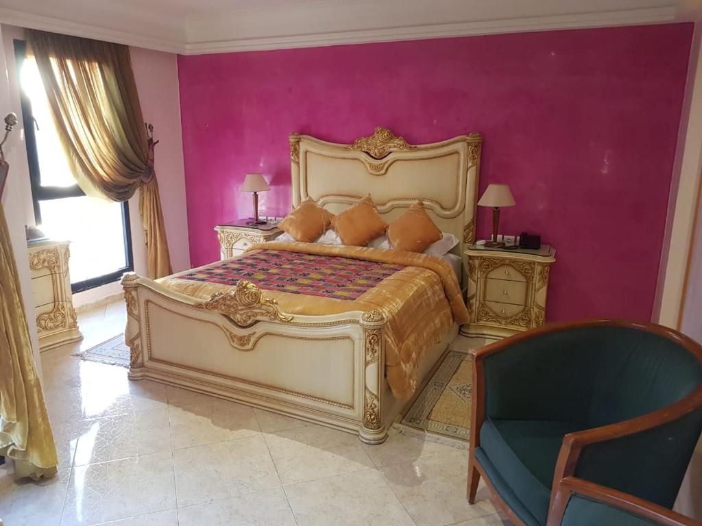 Postel nebo postele na pokoji v ubytování Hotel Mounia