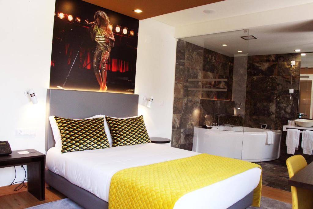 Postel nebo postele na pokoji v ubytování America Diamonds Hotel