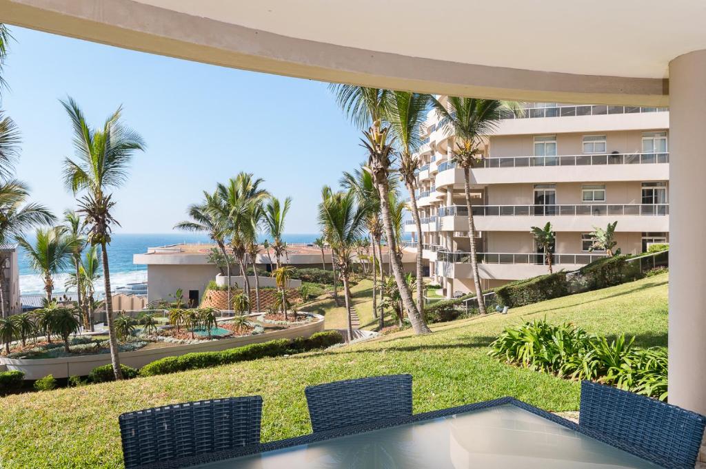 a view of the ocean from the balcony of a resort at Ballito Manor - Manor View 102 in Ballito