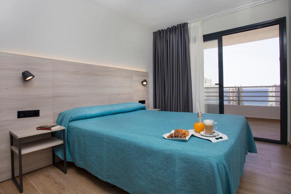 Кровать или кровати в номере Apartamentos Maryciel By Mc