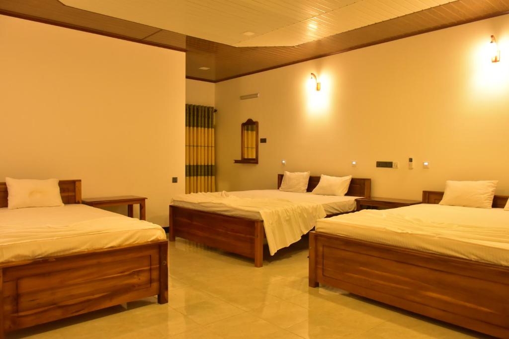 Кровать или кровати в номере Ceylon Safari Cottage