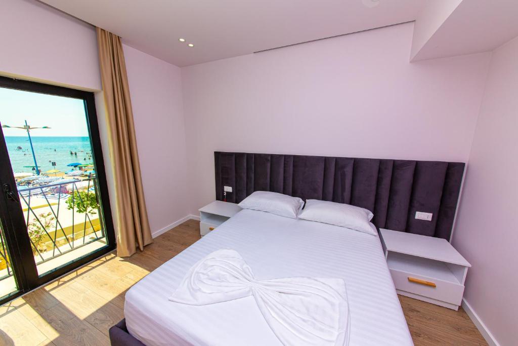 Postel nebo postele na pokoji v ubytování Hotel Alion
