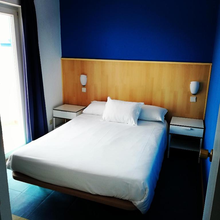 Postel nebo postele na pokoji v ubytování Hotel Eira Da Pedra